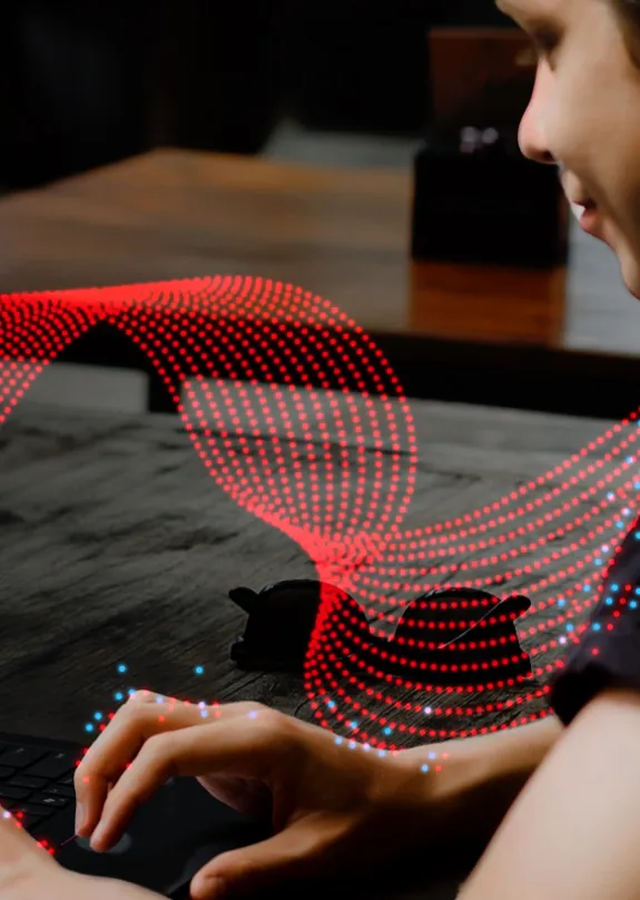 Boy typing on a computer 